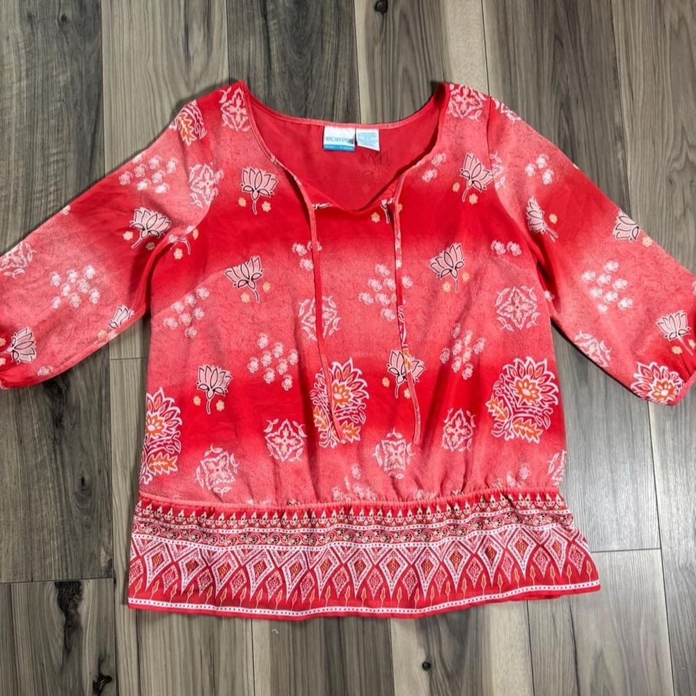 Beautiful maternity blouse featuring a white and red floral print